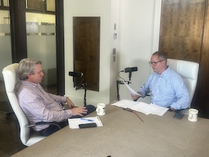 Two men talking in a podcast